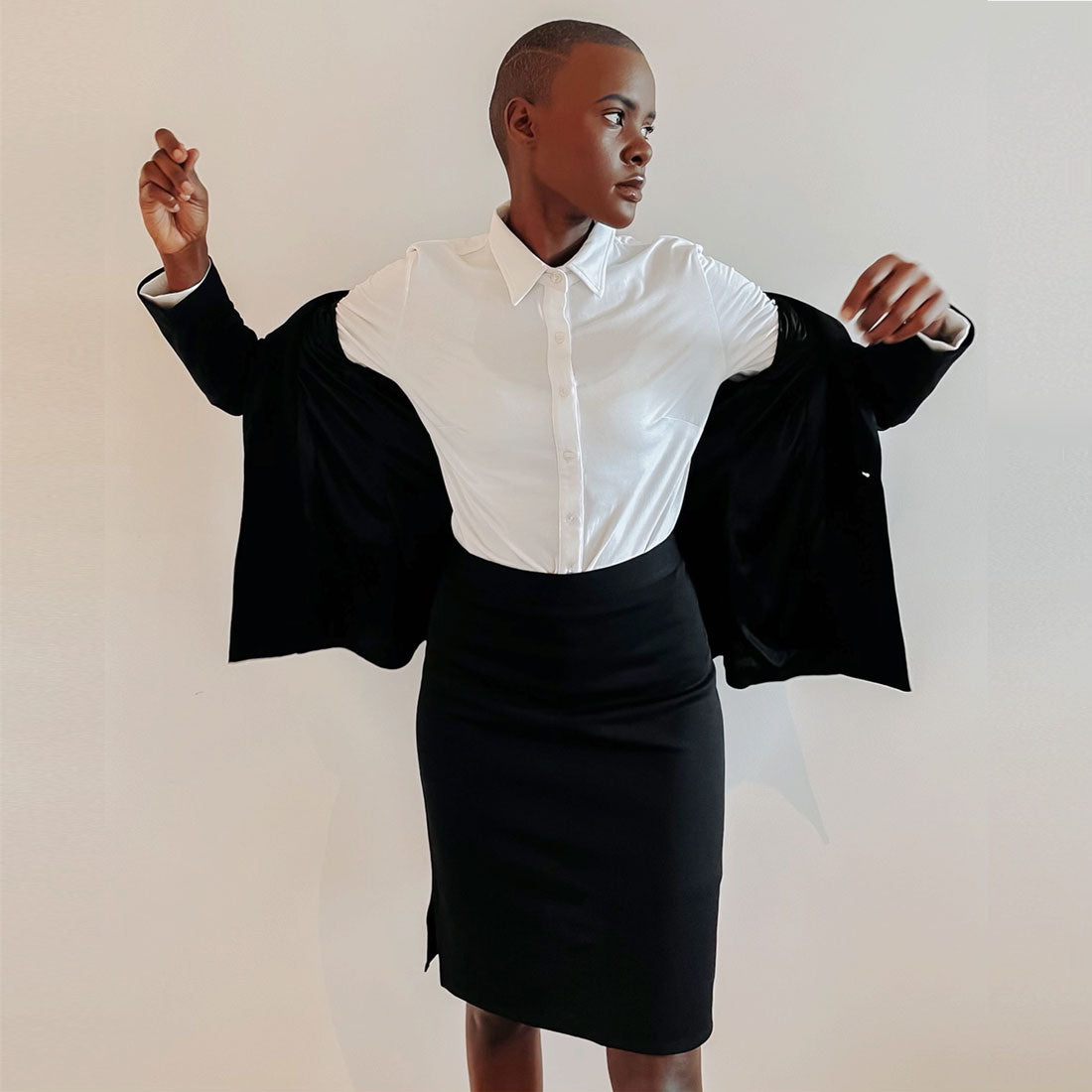https://ergonaut.co/cdn/shop/products/woman-in-a-high-waisted-black-skirt.jpg?v=1658904974&width=1445